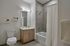Contemporary bathroom featuring a stylish vanity, modern shower, and tasteful decor.