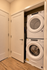 Efficient laundry with stackable washer and dryer in a modern apartment setting.