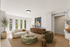 Inviting living room with chic furniture, large windows, and elegant decor; perfect for relaxation and style.