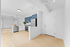 Modern apartment with sleek kitchen featuring stainless steel appliances, elegant cabinetry, and bright, airy design.