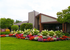 Flower beds and lush greenery.