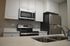 Contemporary kitchen with stainless steel appliances and elegant white cabinetry.