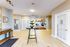 Inviting apartment lobby with elegant decor, warm lighting, and charming wooden furniture for a welcoming atmosphere.