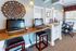 Modern and inviting office space with stylish decor, featuring computers and cozy seating perfect for productivity.