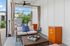 Stylish outdoor lounge featuring modern furniture, ambient lighting, and serene views.