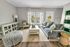Bright and airy living room with modern furniture, cozy seating, and stylish decor.