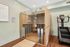 Modern apartment amenity showcasing a sleek glass-front sauna and advanced exercise equipment, perfect for wellness and relaxation.