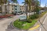 Charming Eagle Walk student living community surrounded by lush palm trees and vibrant landscaping, offering a modern and welcoming atmosphere.
