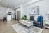 Modern open-concept living space with stylish kitchen, cozy seating area, and elegant decor.