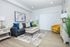 Modern open-concept living space with stylish kitchen, cozy seating area, and elegant decor.