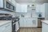 Modern open-concept living space with stylish kitchen, cozy seating area, and elegant decor.