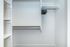 Bright and organized closet space with built-in shelving, dual hanging rods, and a clean, modern finish for easy storage and everyday convenience.
