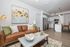 Modern open-concept living space with stylish kitchen, cozy seating area, and elegant decor.