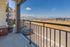 Breathtaking balcony view overlooking vast landscapes and distant mountains, perfect for enjoying serene mornings and vibrant sunsets.