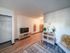 Chic living area with modern decor, sleek wood flooring, stylish furniture, and ambient lighting for a cozy atmosphere.