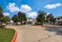 Gated entrance and front drive leading into The Reserve at Rye 290 apartment community.