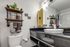 Modern bathroom with vanity sink, open shelving, and towel storage at The Reserve at Rye 290.