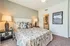 Elegant bedroom with stylish bedding, soft lighting, and sleek decor showcasing modern comfort.
