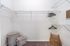 Spacious walk-in closet with sleek wire shelving, ready for customization with stylish storage baskets and hangers.