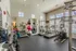 Bright, modern fitness center with state-of-the-art treadmills, exercise bikes, and vibrant yoga balls, perfect for staying fit and healthy.