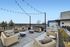 Spacious rooftop terrace with stylish wicker furniture and stunning panoramic views, perfect for relaxation and entertaining.