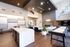 Modern open-concept living space with a luxurious kitchen island, elegant seating area, and stylish decor.