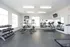 Bright and modern gym with treadmills, ellipticals, and free weights, perfect for a healthy lifestyle.