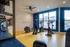 Bright and modern gym featuring state-of-the-art equipment and vibrant decor at Fitzroy Fitness with scenic outdoor views.