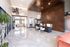 Modern and elegant apartment lobby with sleek wooden accents, stylish reception area, and polished marble flooring at The Fitzroy Promenade.