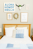 Charming bedroom with cozy bed, inviting blue and white decor, and a cheerful gallery wall featuring playful artwork.