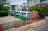 Vibrant urban apartment complex showcasing modern architecture with colorful geometric designs, offering unique city living experience.