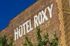 Charming Hotel Roxy with vintage brick facade and bold white lettering, embracing classic urban style.