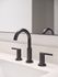 Sleek bathroom faucet set against a pristine white countertop, exemplifying modern elegance and functionality.