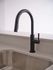 Sleek and modern kitchen faucet with a stylish black finish, set against a pristine countertop for a contemporary look.