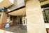 Inviting entrance of The Overture at 1812 University Avenue, showcasing modern architecture and convenient location with pick-up and delivery services.