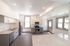 Bright and modern kitchen with sleek stainless steel appliances, spacious countertops, and ample natural light.