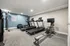 Modern fitness center with state-of-the-art treadmills and exercise equipment in a well-lit room.