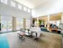 Spacious and inviting community lounge featuring high ceilings, abundant natural light, and stylish seating areas.
