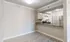 Modern kitchen with sleek stainless steel appliances, chic granite countertops, and light wood flooring exuding elegance.