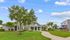 Inviting residential building with manicured landscaping and outdoor play area, enhancing community living.