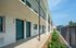 Property exterior with lush greenery.