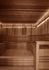 Luxurious wooden sauna room with warm lighting and spacious seating, promising relaxation and comfort.