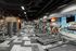 Modern gym equipped with state-of-the-art treadmills, exercise machines, and vibrant design for an energetic workout experience.