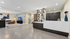 Chic and modern lobby with stunning geometric wall accents, sophisticated seating area, and elegant reception desk.