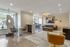 Contemporary apartment lounge with luxurious decor, featuring modern furnishings, elegant lighting, and large windows for natural light.