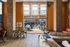 Chic lounge interior with open space, stylish seating, and a view of the outdoor pool area.