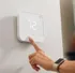 Modern digital thermostat with a sleek design displaying 72 degrees, perfect for maintaining comfort in style.