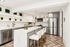 Modern kitchen with elegant white cabinetry, spacious marble countertop island, and stylish stainless steel appliances. Features chic open shelving and comfortable high-back bar stools.