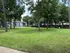 Charming residential community with lush green lawns, mature trees, and inviting outdoor spaces perfect for relaxation and recreation.