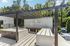 Chic outdoor lounge area at Rosemont Chamblee, featuring modern pergola, stylish seating, and lush greenery.